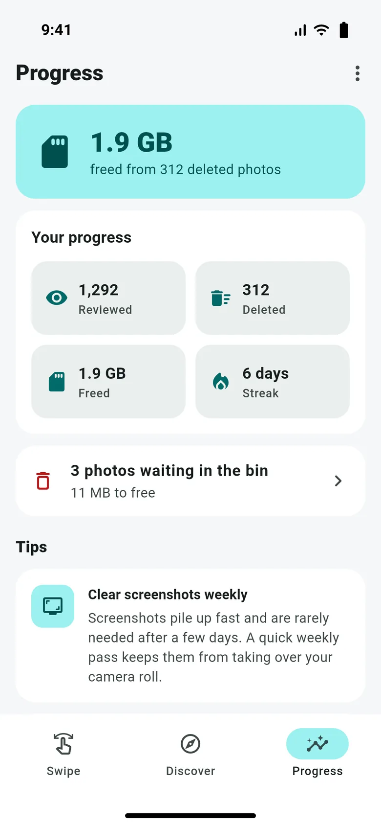 The Progress tab: 1.9 GB freed from 312 deleted photos, with tiles for photos reviewed, deleted, storage freed and a 6-day streak, plus a tip.